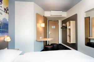 Postel nebo postele na pokoji v ubytování B&B Hotel Wien-Stadthalle