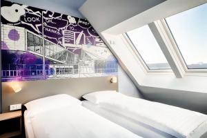Postel nebo postele na pokoji v ubytování B&B Hotel Wien-Stadthalle