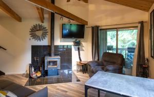 a living room with a fireplace and a tv at Escape to Ptarmigan Village 47 in Whitefish