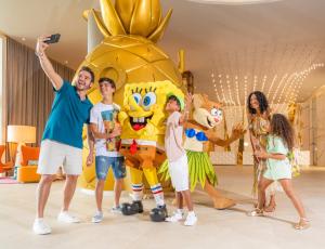 a group of people standing next to a group of mascots at Nickelodeon Hotels & Resorts Riviera Maya All Inclusive in Puerto Morelos