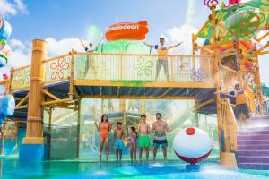 a group of people standing in the water at a water park at Nickelodeon Hotels & Resorts Riviera Maya All Inclusive in Puerto Morelos