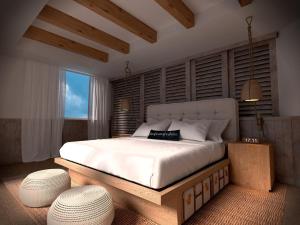 Postel nebo postele na pokoji v ubytování Naay Boutique Hotel Holbox