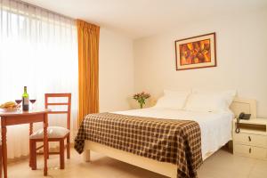 Postel nebo postele na pokoji v ubytování Astorga Hotel Arequipa