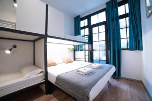 Postel nebo postele na pokoji v ubytování Koba Hostel