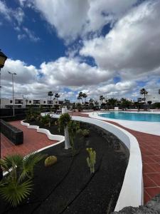 a resort with a swimming pool and a resort at Casa Paula, Costa Teguise in Costa Teguise