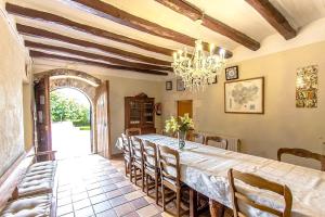 a dining room with a long table and chairs at Catalunya Casas Country Chateau for 22 persons - close to Sitges! in Les Masuques