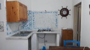 Kuchyň nebo kuchyňský kout v ubytování Villino Celeste fronte spiaggia