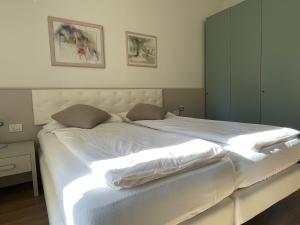 Postel nebo postele na pokoji v ubytování Hotel Garden Arco