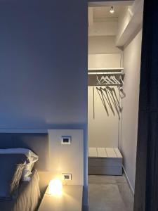 a small bedroom with a bed and a closet at Volsci Rooms in Sora