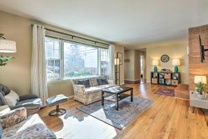 a living room filled with furniture and a large window at Cincinnati Vacation Rental 5 Mi to Downtown! in Cincinnati