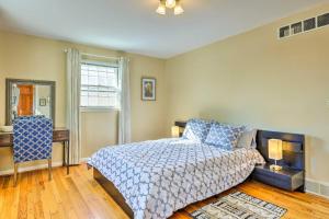 a bedroom with a bed and a table and a window at Cincinnati Vacation Rental 5 Mi to Downtown! in Cincinnati