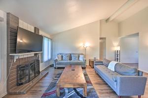 a living room with a couch and a fireplace at Family-Friendly Oceanside Home 5 Mi to Beach in Oceanside