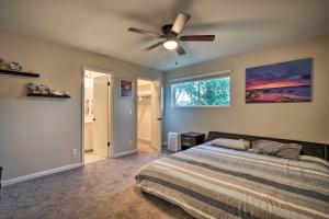 a bedroom with a bed and a ceiling fan at Mesa Home with Outdoor Pool - 2 Mi to Sloan Park! in Mesa +22 photos