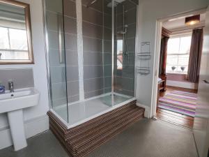 a bathroom with a shower and a sink at Ship Inn in Old Colwyn