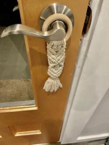 a door knob with a rope hanging on it at Downtown Boho Revival Home PNW in Albany