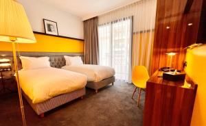 Ένα ή περισσότερα κρεβάτια σε δωμάτιο στο Boutique Hotel Gauthier Restaurant Terrasse