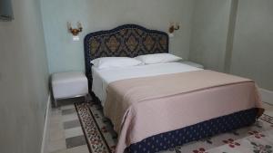 A bed or beds in a room at Baglio Sant’Angelo
