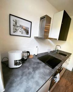 Kuchyň nebo kuchyňský kout v ubytování EXKLUSIVES Loft an der Weserpromenade und Stadt