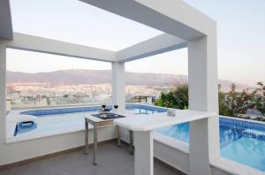 The swimming pool at or close to Athens Lycabettus Hill Penthouse, Private Roof Garden & Pool