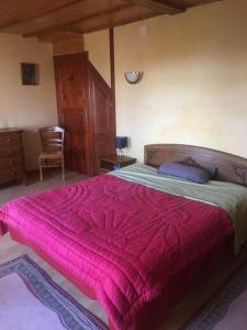 A bed or beds in a room at Gîte à la campagne