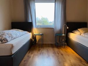Postel nebo postele na pokoji v ubytování Lily-Rose Cottage