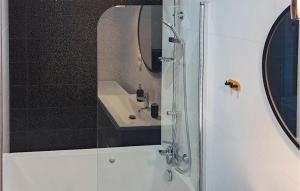 a bathroom with a shower and a sink at Beautiful Apartment In Koszalin in Koszalin +8 photos