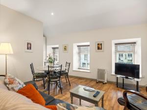 a living room with a couch and a table at Town centre apartment, Clifden in Clifden