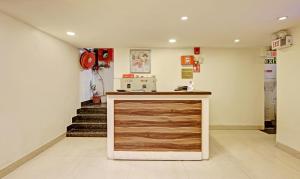 a room with a counter and stairs in the background at Itsy By Treebo - O3 in Chandīgarh