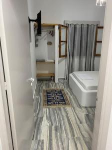 a small bathroom with a toilet and a sink at George's Home Platy Gyalos in Kalymnos +54 photos
