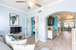 a living room with a couch and a tv at Condo in Paradise -Beach and Intracoastal Waterway in Clearwater Beach