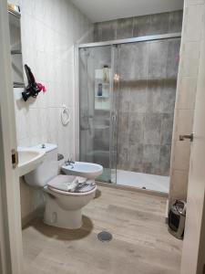 Ένα μπάνιο στο Apartamento Corredoira