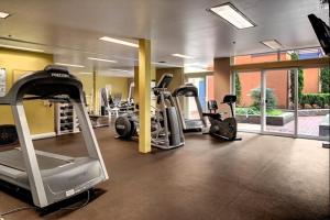 a gym with several treadmills and elliptical machines at Cityscape Dreams in Seattle