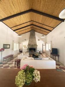 a living room with a couch and a fireplace at Chacra en Emprendimiento Tierra de Caballos in Colonia Estrella