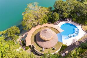 an aerial view of a resort with a pool at Bolontiku Boutique Hotel & Spa in Flores