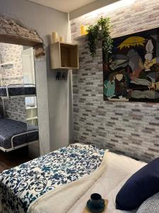 Łóżko lub łóżka w pokoju w obiekcie Coqueto apartamento muy céntrico