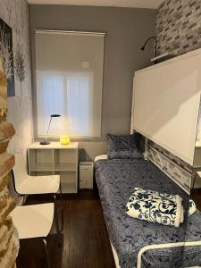 Łóżko lub łóżka w pokoju w obiekcie Coqueto apartamento muy céntrico