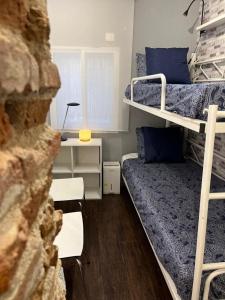 Łóżko lub łóżka w pokoju w obiekcie Coqueto apartamento muy céntrico