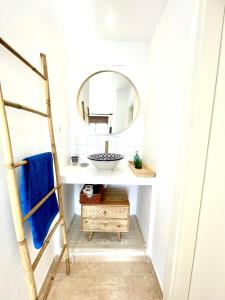 a bathroom with a sink and a mirror at Beach House in La Cala de Mijas