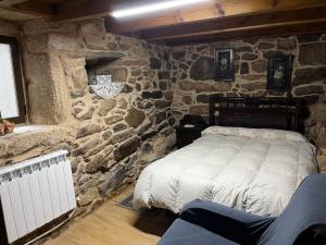 A bed or beds in a room at Casa Xulián