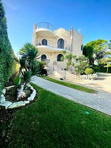 a house with a walkway in front of it at Villa Pignatelli in Bari