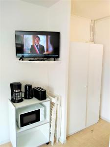 En tv och/eller ett underhållningssystem på Le Petit Aurouze