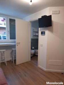 TV a/nebo společenská místnost v ubytování Casa di Cìì