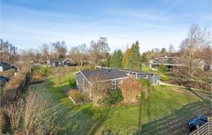 an aerial view of a house with a yard at Awesome Home In lsted With Wifi And 1 Bedrooms in Ølsted