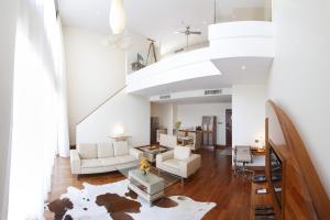 a living room with white furniture and a white ceiling at Airways Hotel in Port Moresby