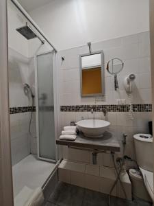 a bathroom with a sink and a shower at Eco B&B Marela in Rome +31 photos