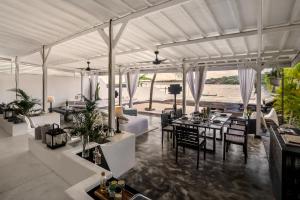 a living room with a view of the water at Villa Lagoon - Elegant & Absolute BeachFront in Nusa Ceningan in Nusa Lembongan