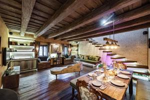 a large living room with a table and chairs at Atrium Konak in Novi Sad