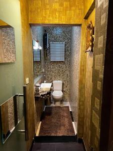 a bathroom with a toilet and a sink at Luxury Modern Appartment in New Cairo in Cairo