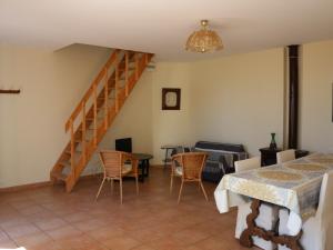 a living room with a staircase and a table and chairs at Appartement Banyuls-sur-Mer, 3 pièces, 5 personnes - FR-1-309-58 in Banyuls-sur-Mer