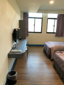 Letto o letti in una camera di Lohas Seaview B&B